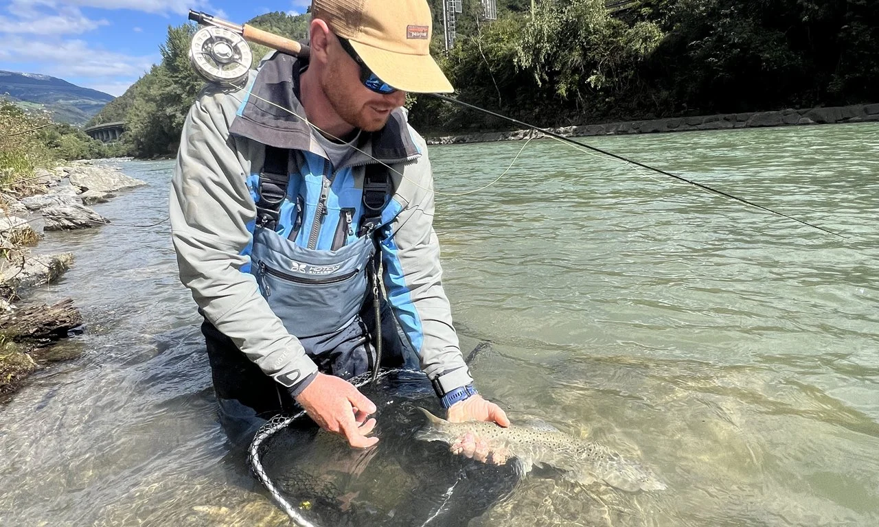 A trophy Marble Trout caught while fly fishing Isarco River in the Italian Dolomites.